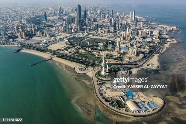 This picture taken on October 27, 2022 shows an aerial view of the landmark Kuwait Towers and the Ras al-Ard cape of Kuwait City overlooking the Gulf...