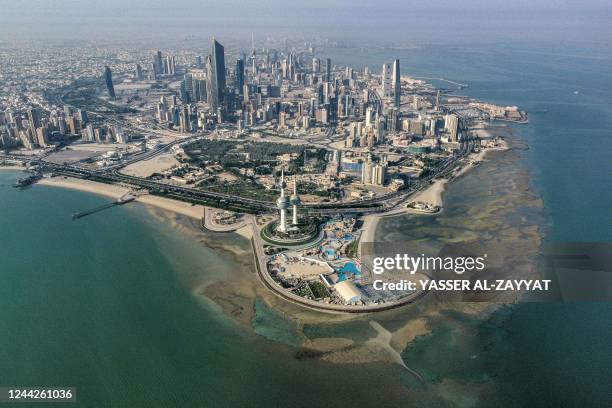 This picture taken on October 27, 2022 shows an aerial view of the landmark Kuwait Towers and the Ras al-Ard cape of Kuwait City overlooking the Gulf...