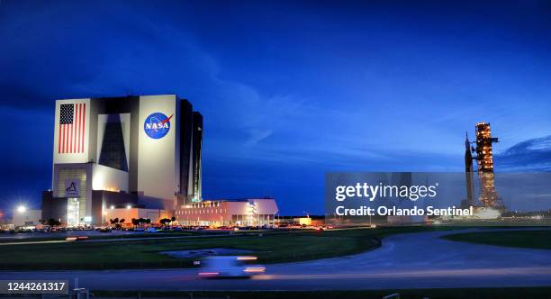 Taking shelter from from Hurricane Ian, NASA&apos;s Artemis I is rolled back to the Vehicle Assembly Building early Tuesday, Sept. 27 at Kennedy...