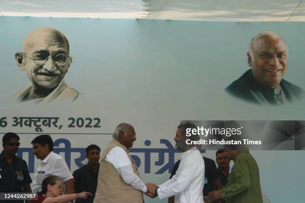 Newly elected Congress President Mallikarjun Kharge with former President Rahul Gandhi during presentation of certificate of election to the party...