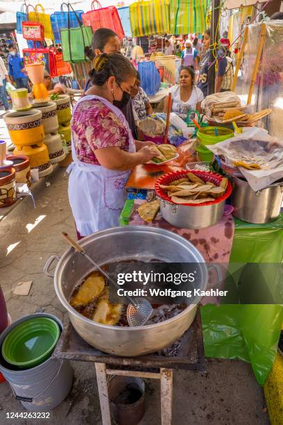 Street kitchen is selling meals at the weekly indigenous market in the small town of Zaachila near Oaxaca City, Mexico.