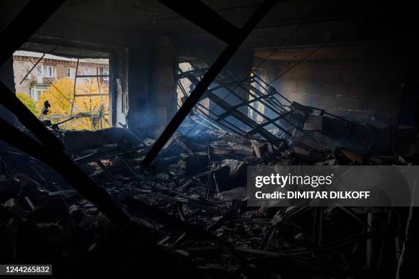 This photograph taken on October 27 shows a view of a destroyed apartment after shelling in the frontline town of Bakhmut, in eastern Ukraine's...
