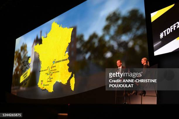 Tour de France General Director Christian Prudhomme and French cyclist and Director of the Women's Tour de France Marion Rousse speak next to the map...