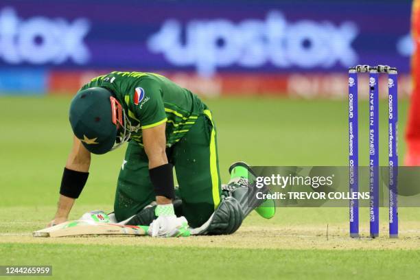 Pakistan's Muhammad Rizwan reacts after diving to make to the crease during the ICC mens Twenty20 World Cup 2022 cricket match between Pakistan and...