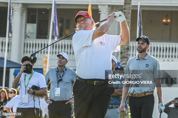 Former US President Donald Trump tees off during a visit a day ahead of the 2022 LIV Golf Invitational Miami at Trump National Doral Miami golf club...