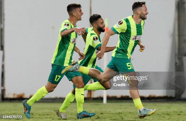 Larnaca's Israeli forward Omri Altman celebrates with teammates after scoring the opening goal during the UEFA Europa League group B football match...