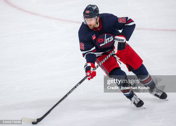 Blake Wheeler of the Winnipeg Jets plays the puck during third period action against the Toronto Maple Leafs at Canada Life Centre on October 22,...