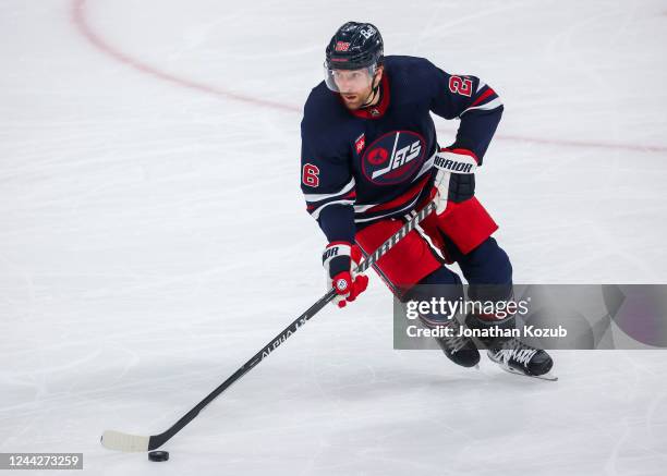 Blake Wheeler of the Winnipeg Jets plays the puck during third period action against the Toronto Maple Leafs at Canada Life Centre on October 22,...