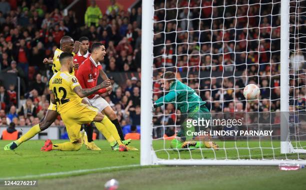 Manchester United's Portuguese striker Cristiano Ronaldo scores the team's third goal during the UEFA Europa League Group E football match between...