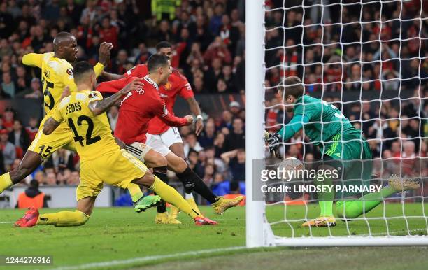 Manchester United's Portuguese striker Cristiano Ronaldo scores the team's third goal during the UEFA Europa League Group E football match between...