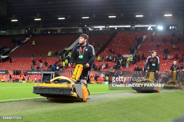 Groundskeepers use electric lawnmowers after the UEFA Europa League Group E football match between Manchester United and Sheriff Tiraspol, at Old...
