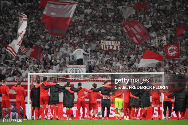 Freiburg's players celebrate with fans after the UEFA Europa League Group G football match between SC Freiburg and Olympiacos FC in Freiburg im...