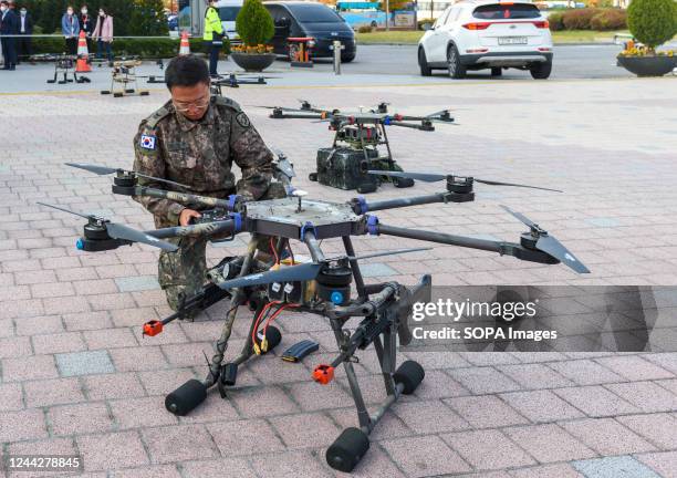 South Korean soldier checks a drone equipped with rifles during a national comprehensive counter-terrorism training. The drill comes amid...