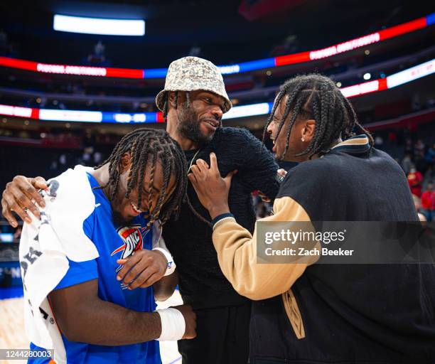 Nerlens Noel of the Detroit Pistons talks to Luguentz Dort and Shai Gilgeous-Alexander of the Oklahoma City Thunder after the game on October 11,...