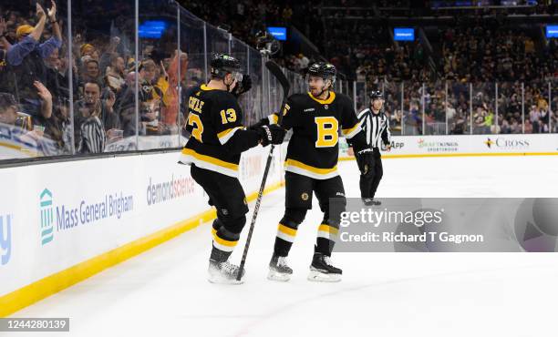 Charlie Coyle of the Boston Bruins celebrates his goal against the Detroit Red Wings with teammate Connor Clifton during the first period at the TD...