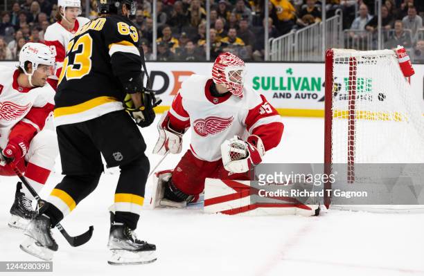 Ville Husso of the Detroit Red Wings watches the puck enter the net as Charlie Coyle of the Boston Bruins scores the goal during the first period at...