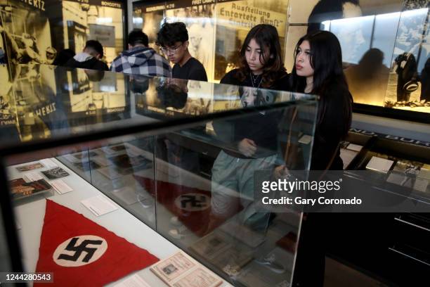 Addy Molina center, and Riley Recinos right, both sophomores at Lawndale High, during a tour at the Holocaust Museum LA on Wednesday, Oct. 26, 2022...
