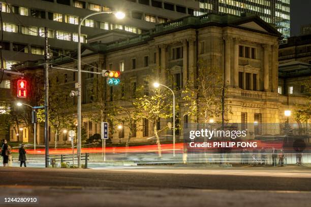 This long exposure picture taken on October 27, 2022 shows the Bank of Japan headquarters in Tokyo.