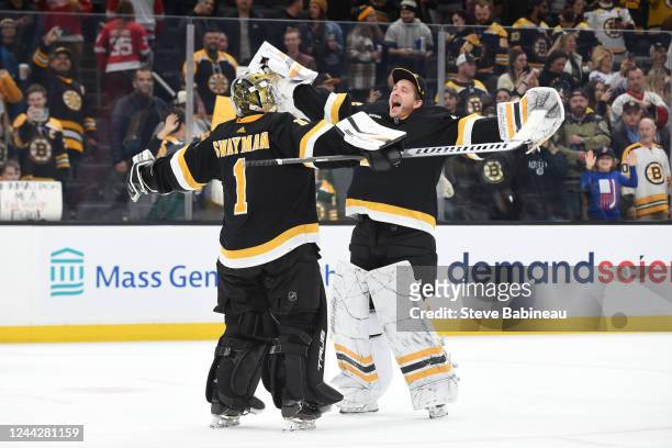 Jeremy Swayman and Linus Ullmark of the Boston Bruins celebrate the win against the Detroit Red Wings at the TD Garden on October 27, 2022 in Boston,...