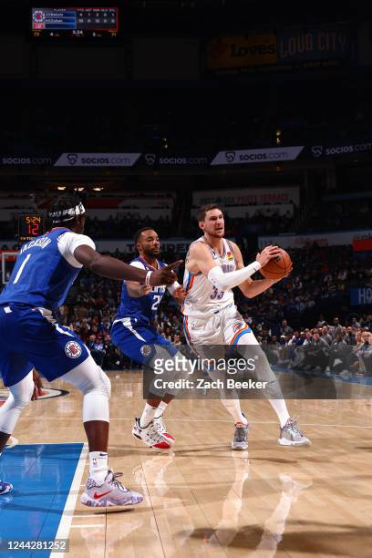 Mike Muscala of the Oklahoma City Thunder handles the ball during the game against the LA Clippers on October 27, 2022 at Paycom Arena in Oklahoma...