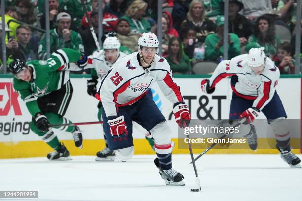 Nic Dowd of the Washington Capitals handles the puck against the Dallas Stars at the American Airlines Center on October 27, 2022 in Dallas, Texas.