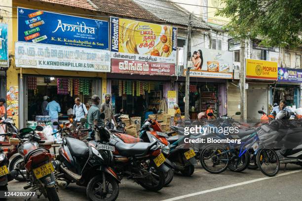 Motorcycles are parked outside a market in Jaffna, Sri Lanka, on Tuesday, Oct. 25, 2022. Sri Lankas 70% inflation is hitting its peak as crippling...