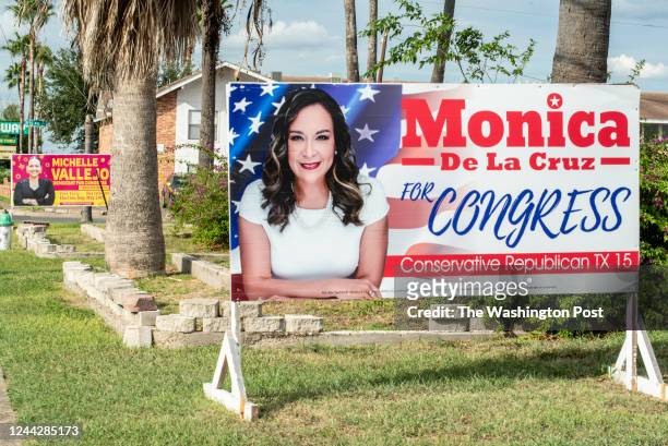 Signs for candidates for Texas' 15th Congressional District Michelle Vallejo and Moncia De La Cruz sit near a sidewalk on Thursday, Oct. 6, 2022 in...