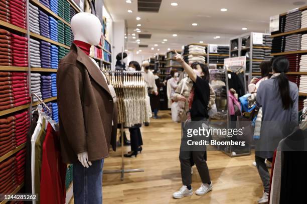Clothing displayed on a mannequin at a newly opened Uniqlo store, operated by Fast Retailing Co., in the Shinjuku district of Tokyo, Japan, on...