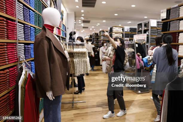 Clothing displayed on a mannequin at a newly opened Uniqlo store, operated by Fast Retailing Co., in the Shinjuku district of Tokyo, Japan, on...