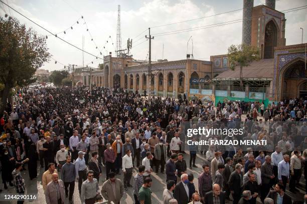 Iranians rally in the western city of Kermanshah, on October 28 to denounce a mass shooting at a key shrine that killed more than a dozen...