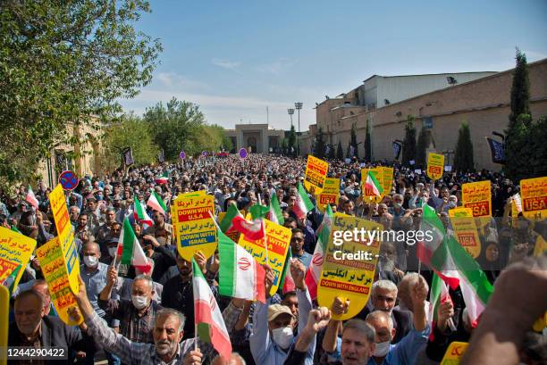 Iranians rally in the southern city of Shiraz, on October 28 to denounce a mass shooting at a key shrine that killed more than a dozen worshippers. -...