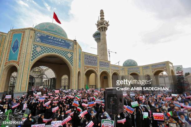 Iranians rally in the central city of Isfahan, on October 28 to denounce a mass shooting at a key shrine that killed more than a dozen worshippers. -...