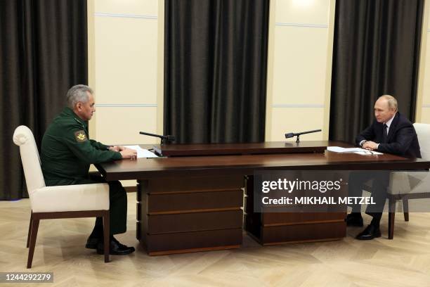 Russian President Vladimir Putin meets with Defence Minister Sergei Shoigu at the Novo-Ogaryovo state residence, outside Moscow, on October 28, 2022....