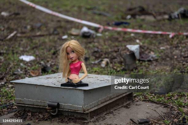 Child's doll lies on the ground outside an apartment block that was destroyed by a Russian missile attack earlier in the month, on October 28, 2022...