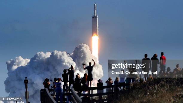 The crowd cheers at Playalinda Beach in the Canaveral National Seashore, just north of the Kennedy Space Center, during the launch of the SpaceX...