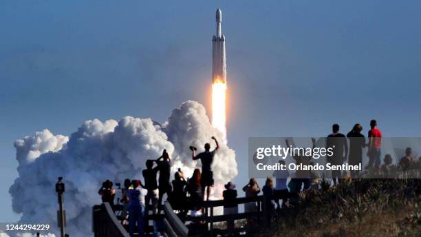 The crowd cheers at Playalinda Beach in the Canaveral National Seashore, just north of the Kennedy Space Center, during the launch of the SpaceX...