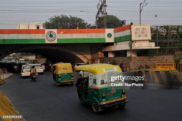 Vehicles move as A board coloured with Tri-Color or Indian National flag color is seen in New Delhi India on 28 October 2022