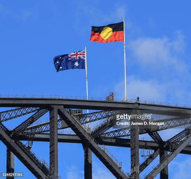The Australian national flag flies alongside the Aboriginal flag atop the Sydney Harbour Bridge on May 26, 2020 in Sydney, Australia.