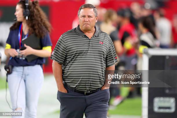 Tampa Bay Buccaneers Quarterbacks Coach Clyde Christensen walks onto the field before the regular season game between the Baltimore Ravens and the...