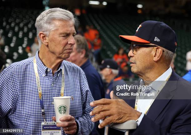 President of Baseball Operations for the Philadelphia Phillies David Dombrowski talks with Hall of Famer Reggie Jackson on field before Game 1 of the...