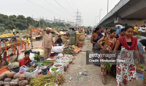 People buy pooja ingredients for the on the eve of Chhath Puja at Geeta Colony on October 28, 2022 in New Delhi, India. The four-day celebrations of...