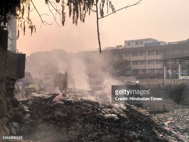 Garbage burn and smog in the weather at Kanti Nagar on October 28, 2022 in New Delhi, India. Air pollution in Delhi NCR is at its highest since...