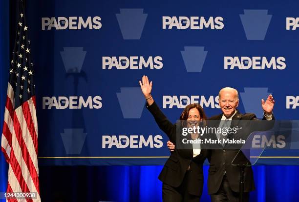 President Joe Biden and US Vice President Kamala Harris wave to supporters during the Democratic Party's Independence Dinner on October 28, 2022 in...