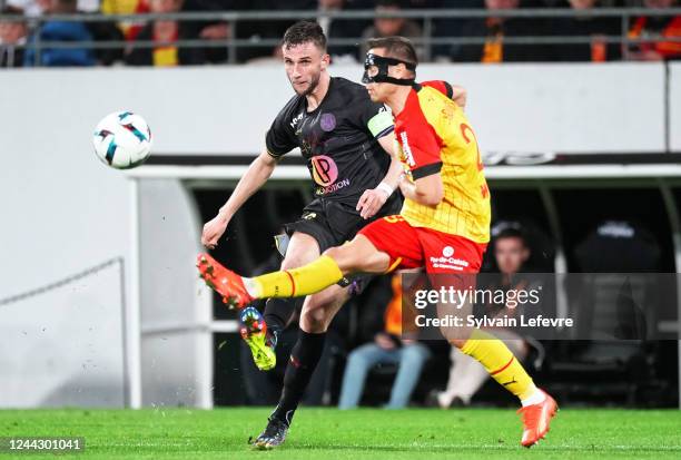 Branco van den Boomen of Toulouse FC is challenged by Przemyslaw Adam Frankowski of RC Lens during the Ligue 1 match between RC Lens and Toulouse FC...