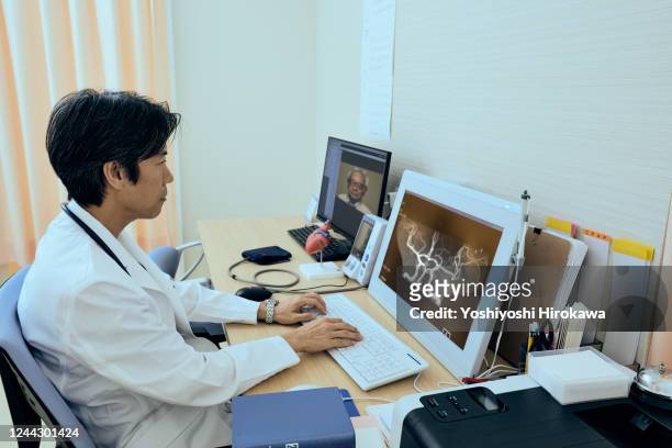 essential workers for advanced telemedicine - cervix stock-fotos und bilder