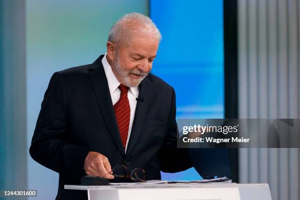 Former president and candidate Luiz Inacio Lula Da Silva of Worker’s Party reads notes before a debate organized by Brazilian media conglomerate...