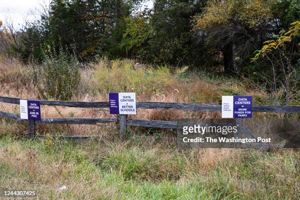 Signs advocating for the construction of the 2,100-acre complex of data centers at the proposed site of the Prince William Digital Gateway in...