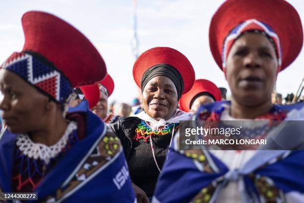 Zulu women clad in traditional dresses arrive at the Moses Mabhida Stadium in Durban on October 29 for the handover of the official certificate of...
