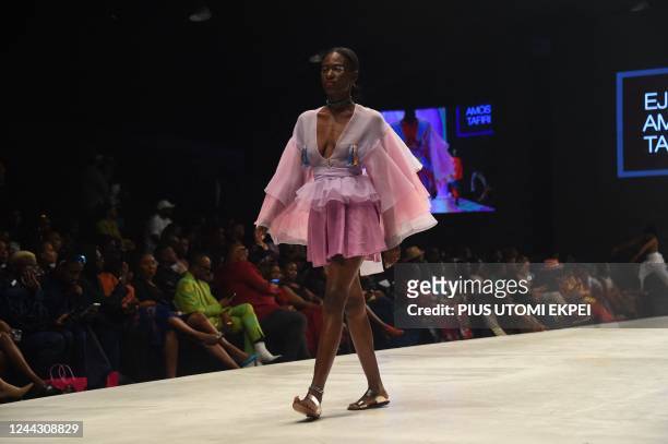 Model walks the runway to showcase design by Ejiro Amos Tafiri during the Lagos Fashion Week in Lagos on October 28, 2022. - Lagos Fashion Week is...