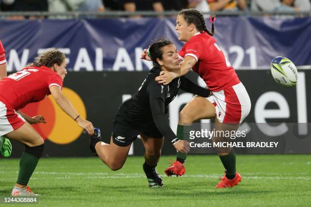 New Zealands Stacey Fluhler offloads the ball in the tackle during the New Zealand 2021 Womens Rugby World Cup quarter-final match between New...